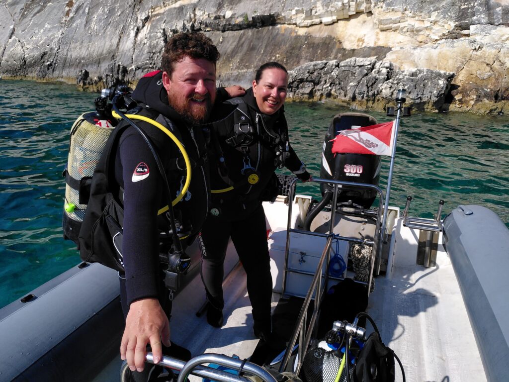couple in diving gear on RIB