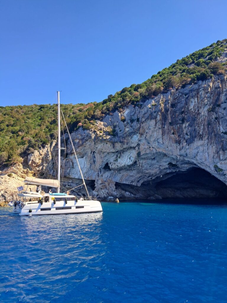 Catamaran in front of Cave