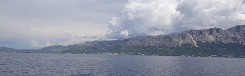 Ionian Sea looking at mainland with thick clouds above