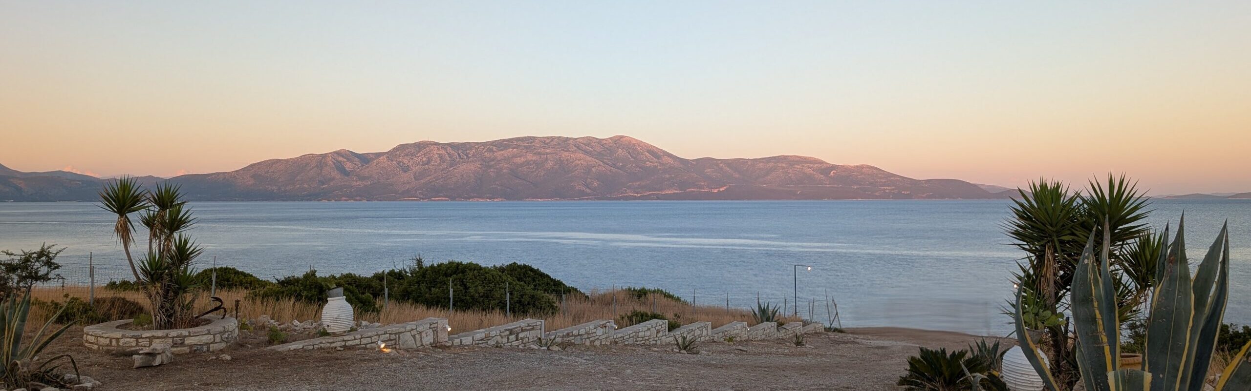 sundown on island with red maountains